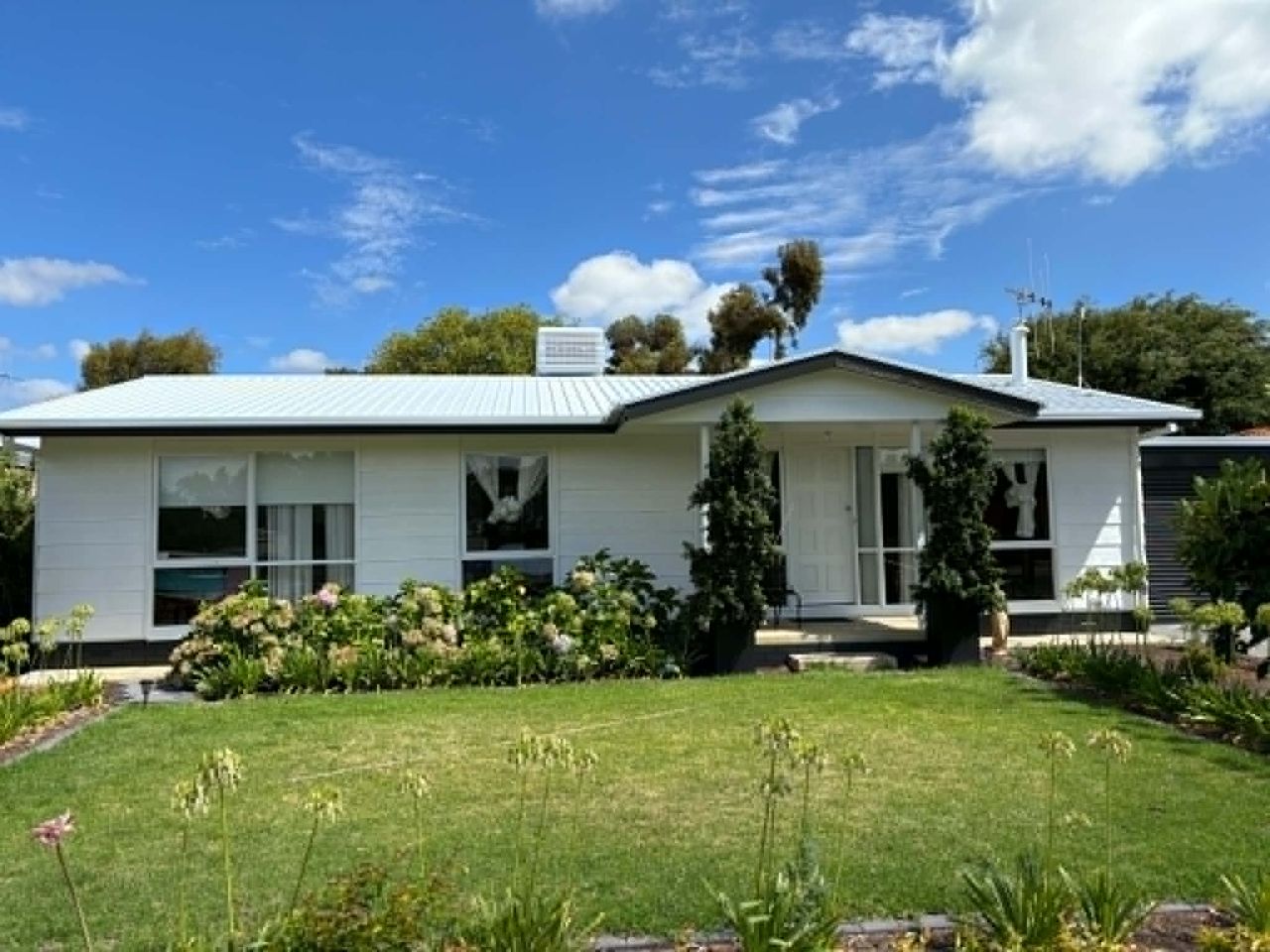 Same house exterior after repaint