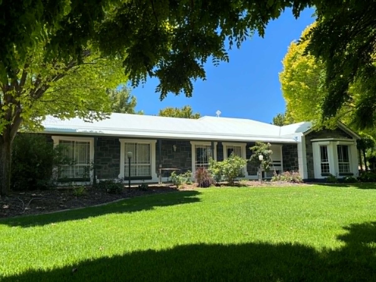 A freshly repainted Riverland home with crisp white roof and trim